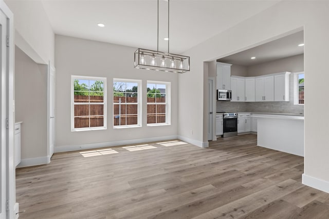 5426 Van Horn Dr, Granbury, TX 76048 - unfurnished dining area with baseboards, recessed lighting, and light wood-style floors
