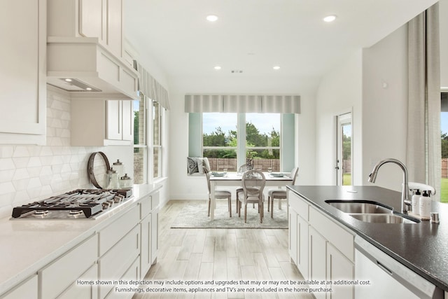 2602 Bear Trl, Mansfield, TX 76063 - kitchen featuring white dishwasher, a sink, stainless steel gas cooktop, decorative backsplash, and recessed lighting