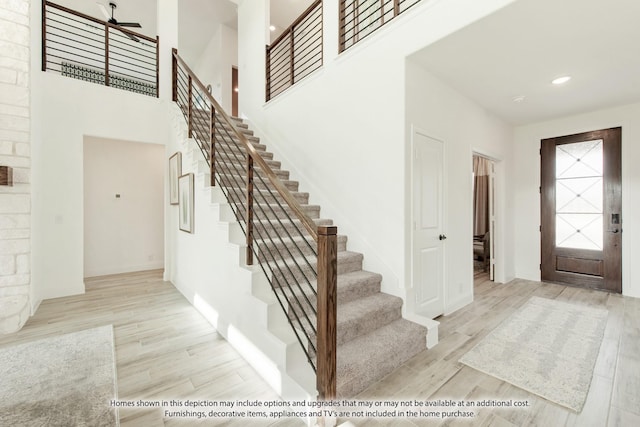 2602 Bear Trl, Mansfield, TX 76063 - foyer entrance featuring stairway, a high ceiling, wood finished floors, baseboards, and ceiling fan