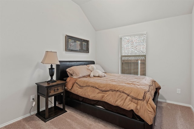 carpeted bedroom with vaulted ceiling and baseboards