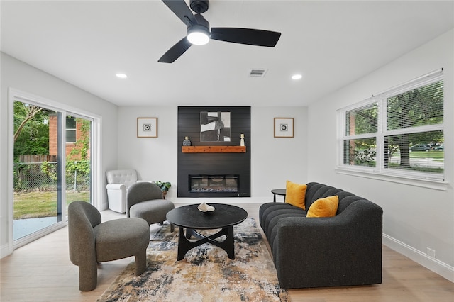 841 Lake Terrace Cir, Dallas, TX 75218 - living area with light wood-style flooring, a fireplace, recessed lighting, baseboards, and a ceiling fan