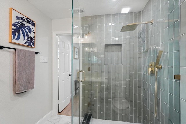 841 Lake Terrace Cir, Dallas, TX 75218 - full bathroom with a stall shower, baseboards, and marble finish flooring