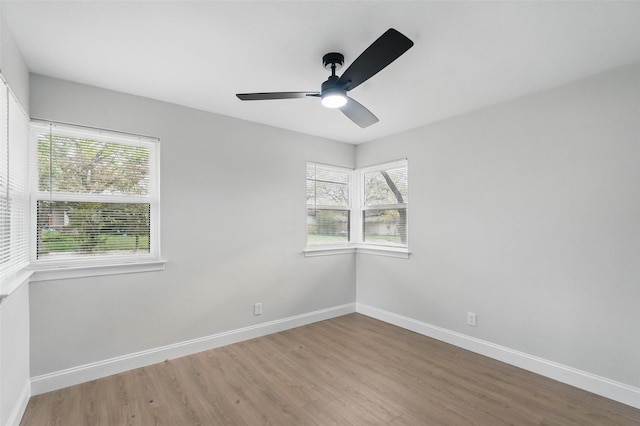 841 Lake Terrace Cir, Dallas, TX 75218 - spare room featuring plenty of natural light, wood finished floors, baseboards, and ceiling fan