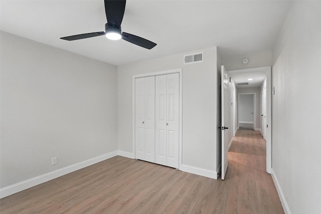 841 Lake Terrace Cir, Dallas, TX 75218 - unfurnished bedroom with light wood finished floors, a closet, baseboards, and ceiling fan