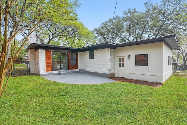 841 Lake Terrace Cir, Dallas, TX 75218 - rear view of house featuring a patio area, brick siding, and a gate