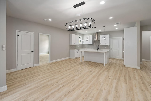 208 Splitrail Dr, Mabank, TX 75143 - kitchen with open shelves, light wood-type flooring, white cabinets, wall chimney exhaust hood, and recessed lighting