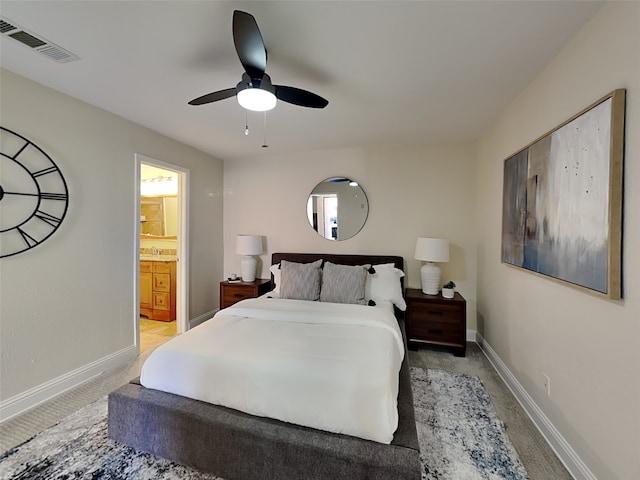 bedroom with visible vents, baseboards, and light carpet