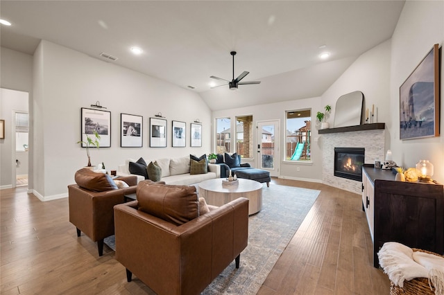 11721 Bull Creek Dr, Northlake, TX 76226 - living room featuring a ceiling fan, hardwood / wood-style flooring, lofted ceiling, a glass covered fireplace, and recessed lighting