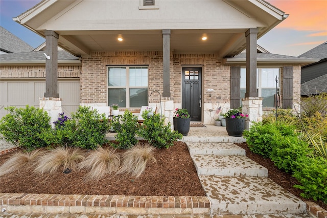 11721 Bull Creek Dr, Northlake, TX 76226 - doorway to property with a porch, brick siding, and an attached garage