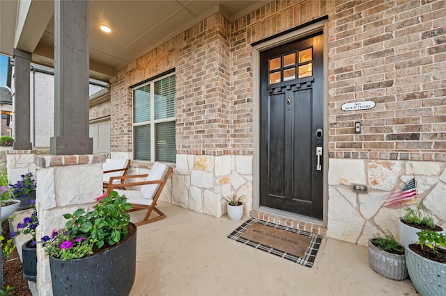 11721 Bull Creek Dr, Northlake, TX 76226 - doorway to property featuring brick siding, covered porch, and stone siding