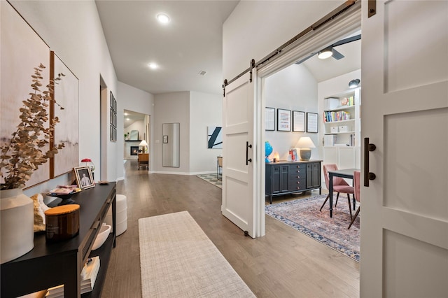 11721 Bull Creek Dr, Northlake, TX 76226 - hall featuring a barn door and wood finished floors