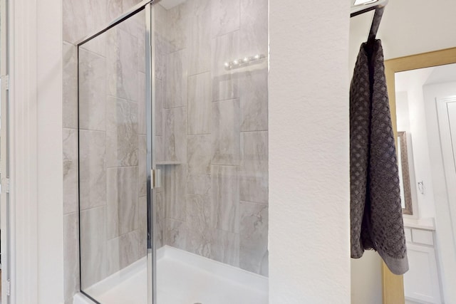 bathroom with a stall shower