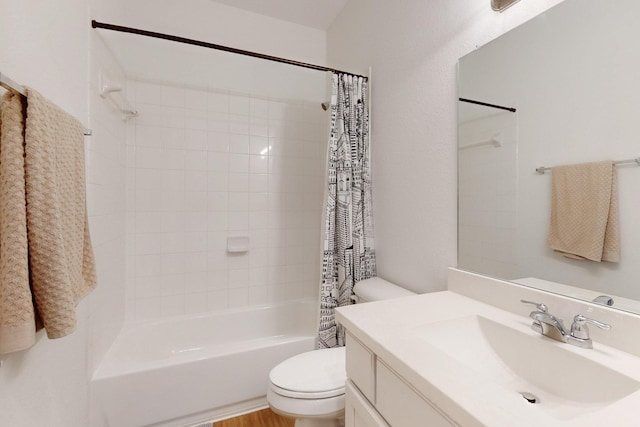 full bath featuring toilet, shower / bath combo, and vanity
