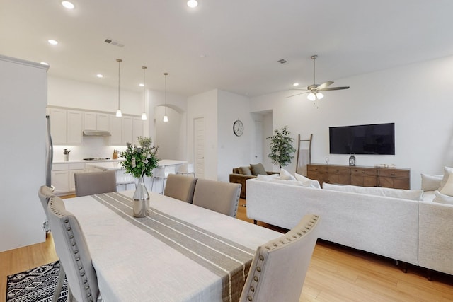dining space with recessed lighting, a ceiling fan, visible vents, and light wood-style flooring
