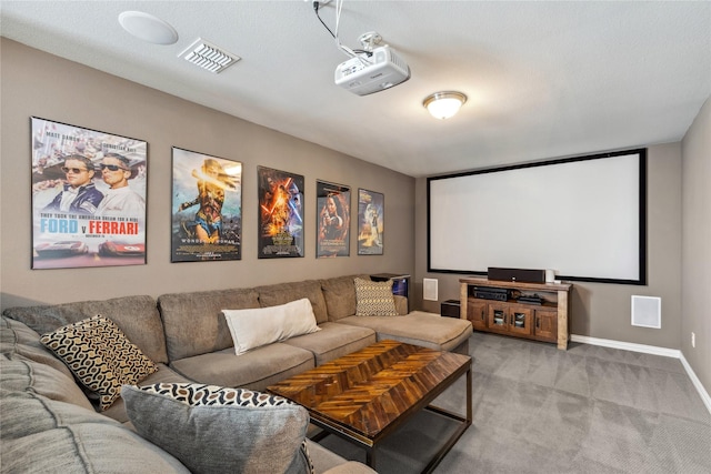 home theater with visible vents, baseboards, and light carpet