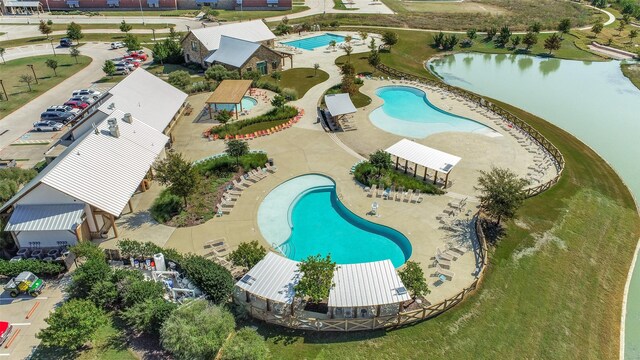 birds eye view of property with a water view