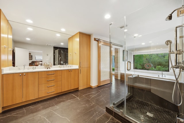 full bath featuring a shower stall, marble finish floor, double vanity, and recessed lighting
