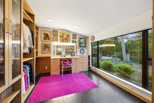 office space with lofted ceiling, recessed lighting, and a healthy amount of sunlight