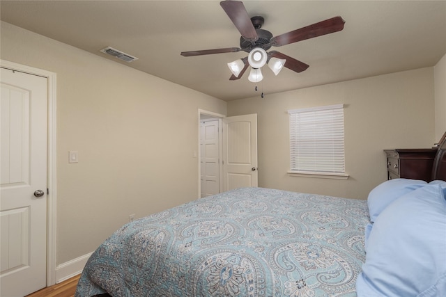113 S Hill Top Ct, Springtown, TX 76082 - bedroom featuring wood finished floors, baseboards, a ceiling fan, and visible vents