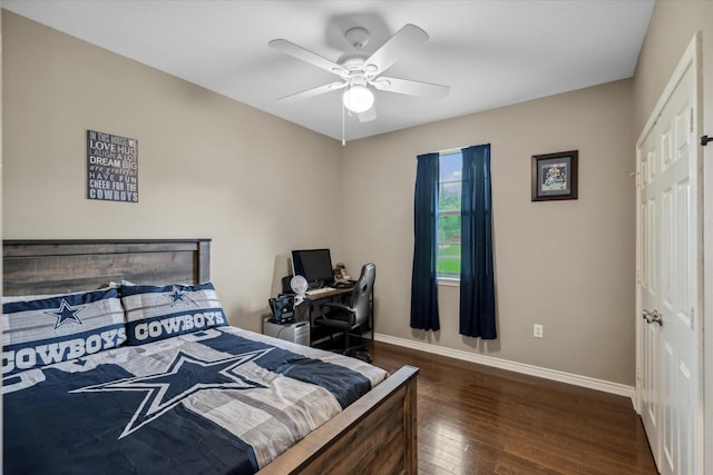 bedroom with a ceiling fan, baseboards, and wood-type flooring