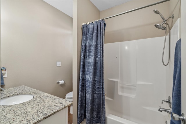 full bath featuring vanity, toilet, and shower / bath combo