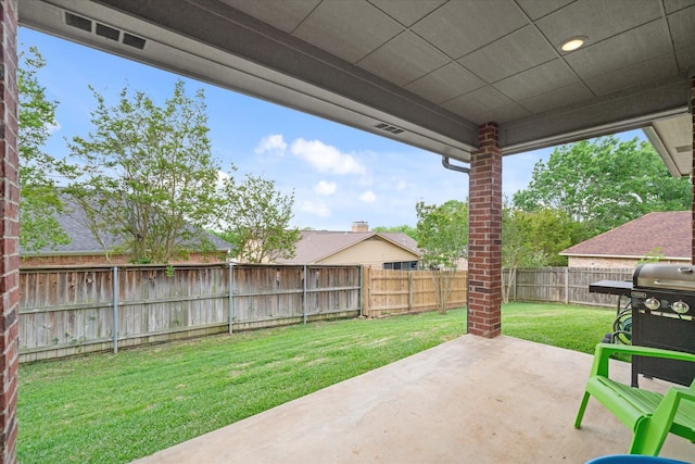 view of patio / terrace with area for grilling and a fenced backyard