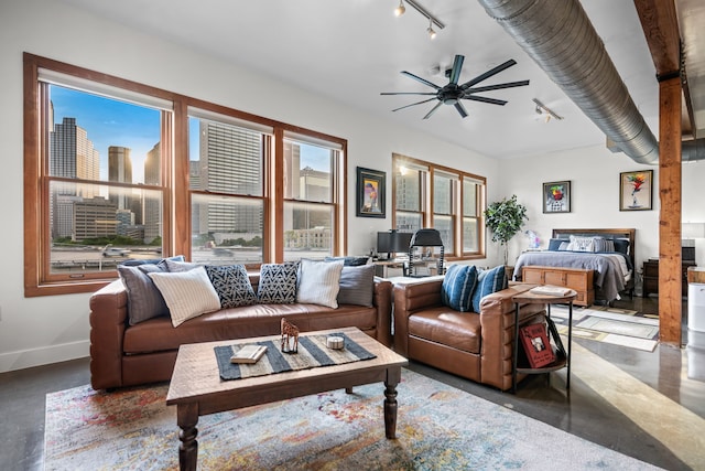 2502 Live Oak St Unit 332, Dallas, TX 75204 - living area featuring a ceiling fan, baseboards, and concrete floors