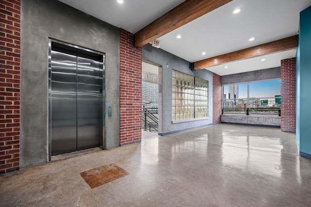 2502 Live Oak St Unit 332, Dallas, TX 75204 - community lobby with brick wall, beam ceiling, and recessed lighting
