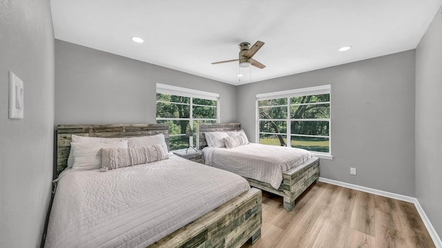 bedroom featuring baseboards, ceiling fan, recessed lighting, and wood finished floors