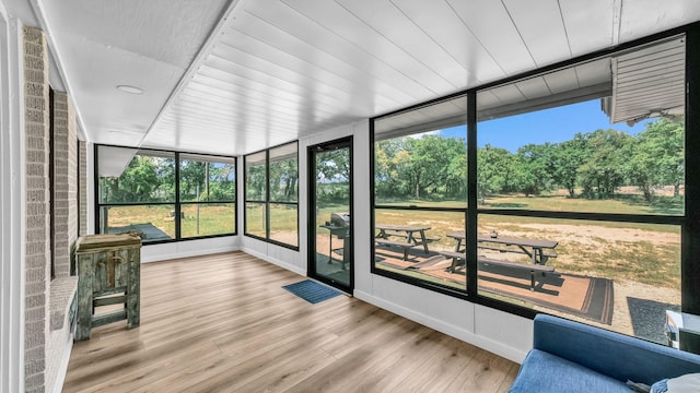 unfurnished sunroom with a healthy amount of sunlight