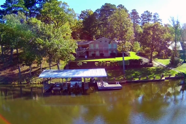exterior space featuring boat lift and a water view