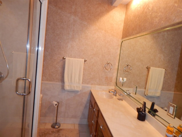 bathroom featuring vanity, tile patterned flooring, and a stall shower
