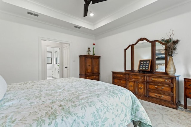 bedroom featuring ceiling fan, visible vents, crown molding, and ensuite bathroom