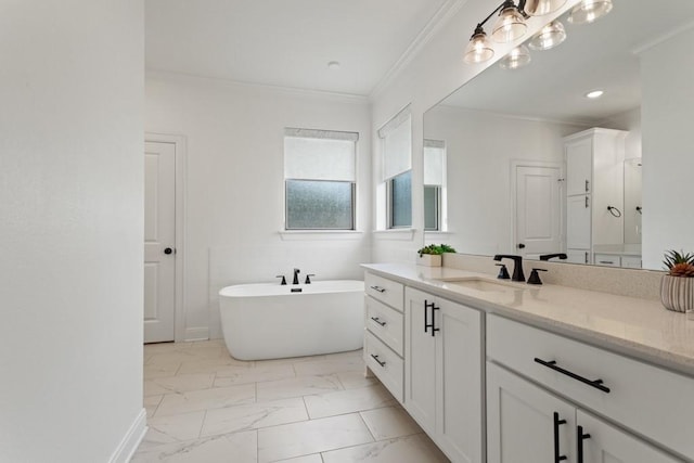bathroom featuring a freestanding bath, crown molding, marble finish floor, and vanity