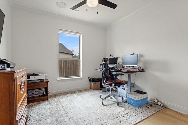 home office with ceiling fan, baseboards, crown molding, and wood finished floors