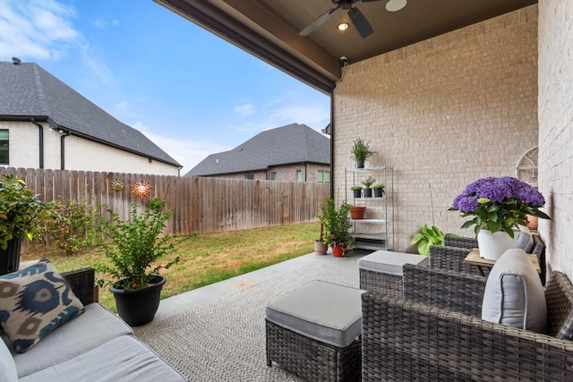 view of patio / terrace featuring outdoor lounge area, a fenced backyard, and ceiling fan
