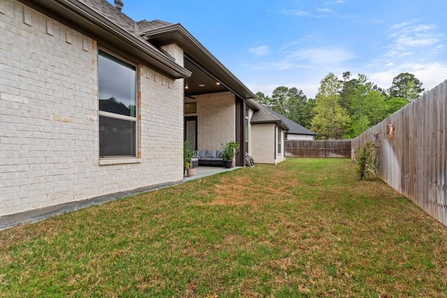 view of yard with a fenced backyard
