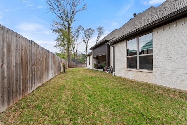 view of yard with a fenced backyard
