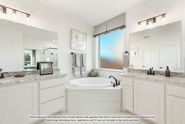 full bath with a shower stall, tile patterned flooring, a sink, a bath, and two vanities