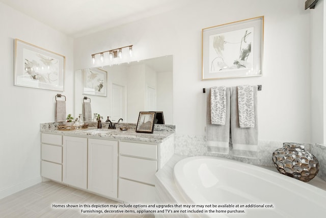 full bathroom with baseboards, a garden tub, and vanity