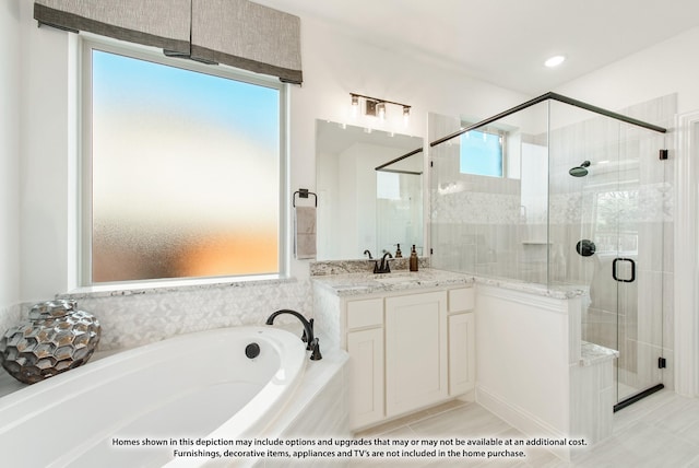bathroom featuring a garden tub, vanity, tile patterned flooring, and a stall shower