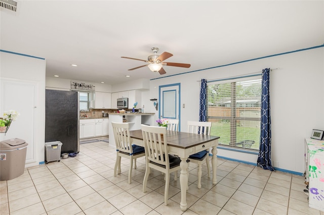 dining room featuring baseboards, visible vents, recessed lighting, a ceiling fan, and light tile patterned floors