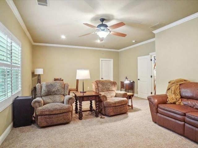 living area featuring ornamental molding, visible vents, carpet flooring, and a ceiling fan