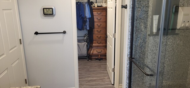 35 County Road 2342, Sulphur Springs, TX 75482 - bathroom with a shower with door and wood finished floors