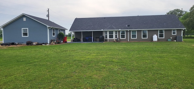 35 County Road 2342, Sulphur Springs, TX 75482 - rear view of house with a patio area, a lawn, and central AC