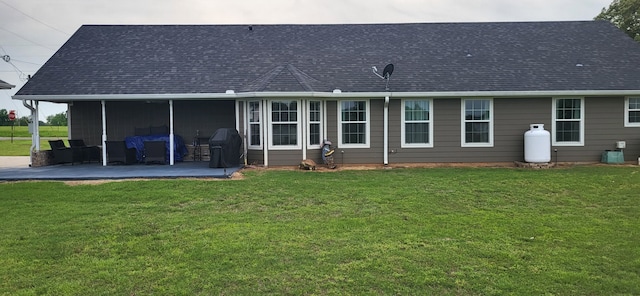35 County Road 2342, Sulphur Springs, TX 75482 - rear view of house featuring a yard, a shingled roof, and a patio