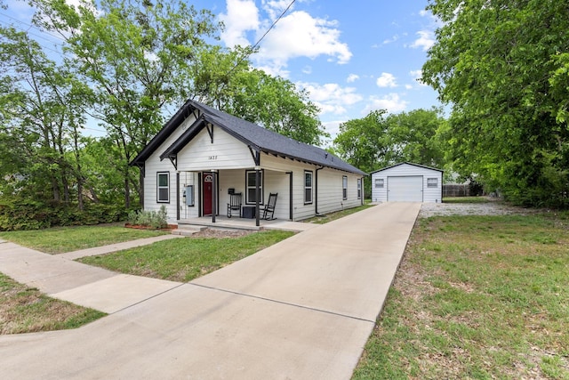 1425 E Cherry, Sherman, TX 75090 - bungalow with a detached garage, concrete driveway, covered porch, an outbuilding, and a front yard