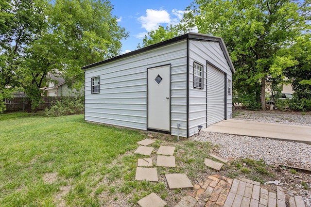 1425 E Cherry, Sherman, TX 75090 - view of outdoor structure featuring fence and an outbuilding