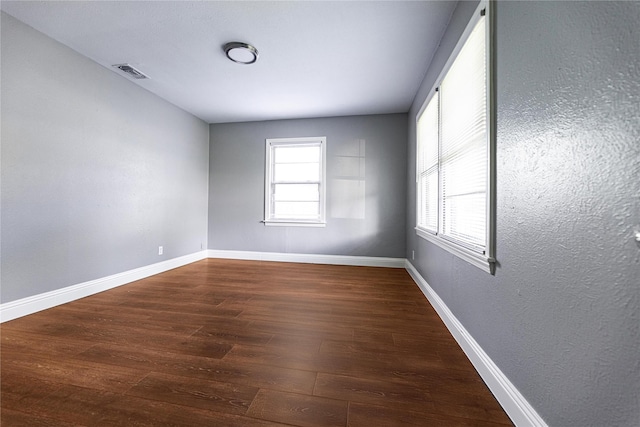 3143 Grayson Dr, Dallas, TX 75224 - unfurnished room with wood finished floors and baseboards