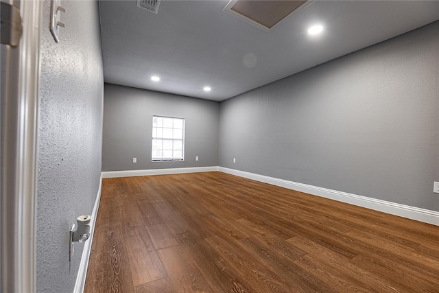 3143 Grayson Dr, Dallas, TX 75224 - empty room featuring dark wood-style floors, baseboards, and recessed lighting